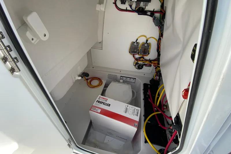Slide: The Image of 2026 Sportsman Heritage 231 Center Console storage with Yamaha propeller box and wiring. - 37