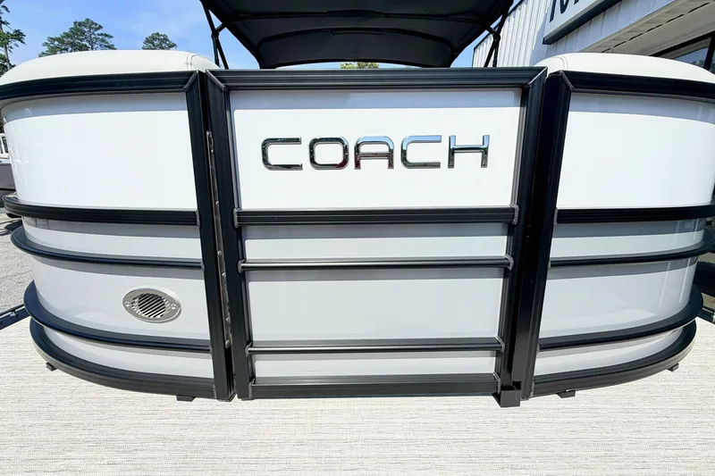 Slide: The Image of 2026 Coach Pontoons 223 RFC front view with sleek design and logo. - 4