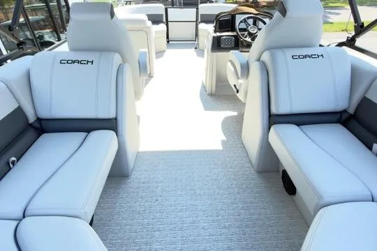 Slide: The Image of 2026 Coach Pontoons 223 RFC interior with luxurious white seating and modern dashboard. - 23