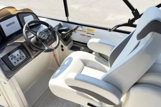 Slide: The Image of 2026 Coach Pontoons 223 RFC interior with modern steering and comfortable seating. - 19