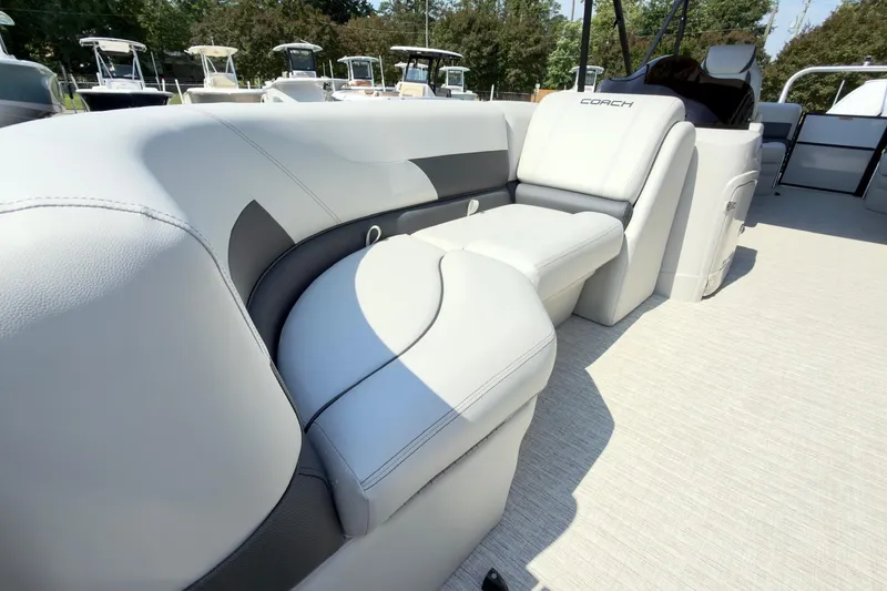 Slide: The Image of Luxurious seating on 2026 Coach Pontoons 223 RFC boat, featuring sleek design and comfort. - 7
