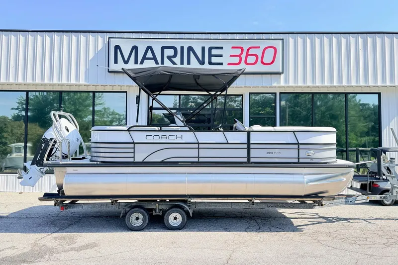 The Image of 2026 Coach Pontoons 223 RFC boat on trailer at Marine 360 dealership. - 1