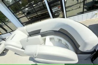 Slide: The Image of 2026 Coach Pontoons 223 RFC boat with sleek, modern seating design. - 9