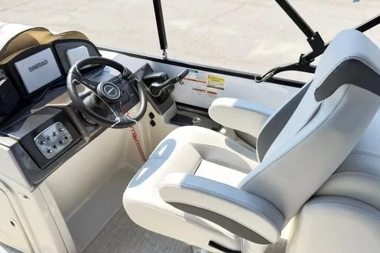 Slide: The Image of 2026 Coach Pontoons 223 RFC helm with modern steering and comfortable seating. - 20