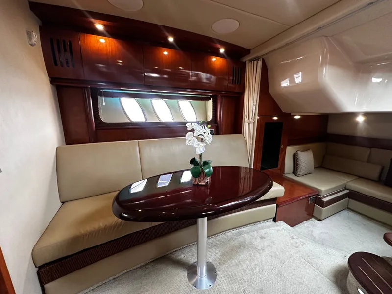 Slide: The Image of Interior of a Sea Ray 380 Sundancer with elegant seating area and table. - 20