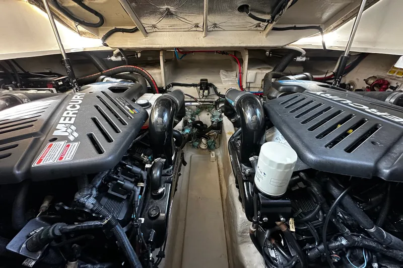 Slide: The Image of The engine room of a 2006 Sea Ray 380 Sundancer features two powerful Mercury engines. - 30
