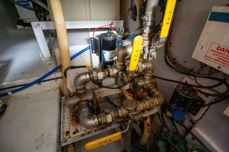 Slide: The Image of Engine room with pipes and valves, Custom 50, year 2010. - 49