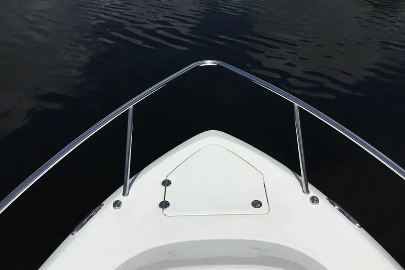 Slide: The Image of Bow view of 2013 Everglades 320EX boat on calm water. - 15