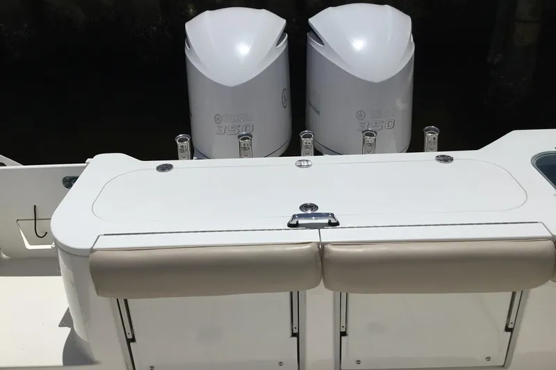 Slide: The Image of 2013 Everglades 320EX boat with dual Yamaha 350 engines, featuring a sleek white design. - 34