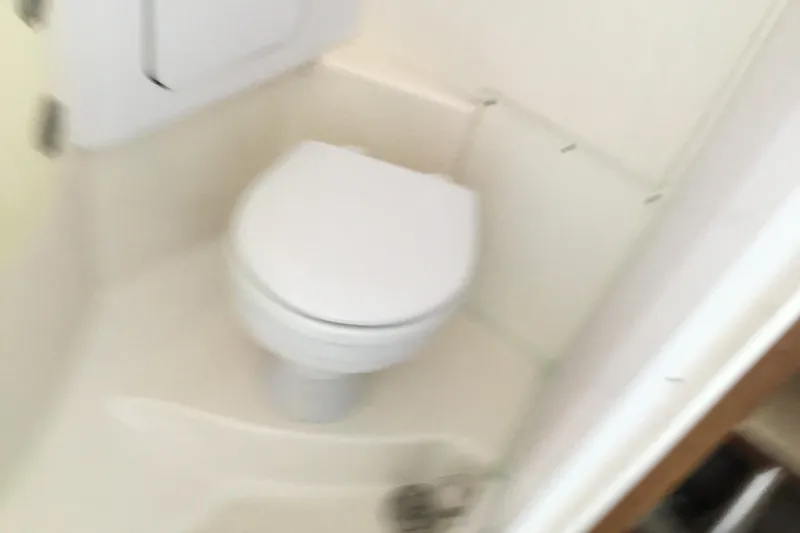 Slide: The Image of Compact bathroom with toilet in 2013 Everglades 320EX boat. - 54