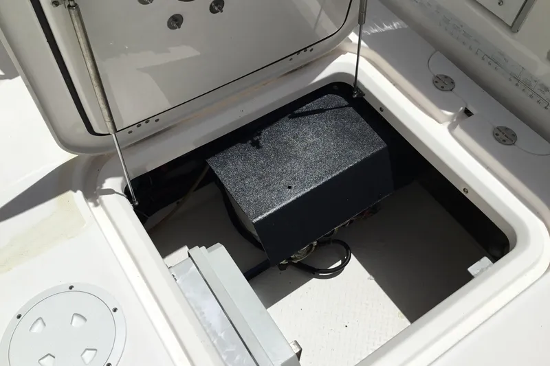 Slide: The Image of Open hatch on 2013 Everglades 320EX boat revealing internal compartment. - 41