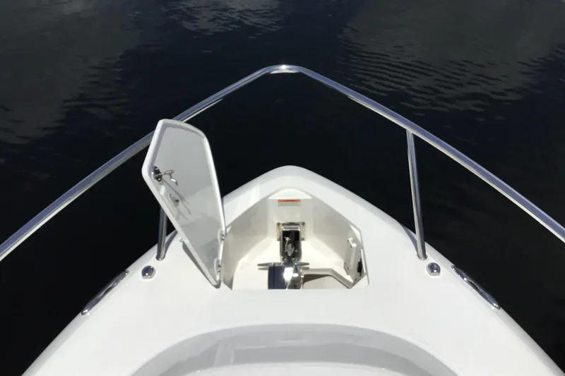 Slide: The Image of Bow view of 2013 Everglades 320EX boat with open anchor hatch. - 16