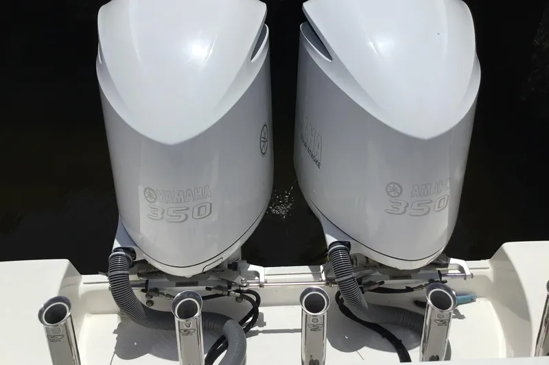Slide: The Image of Twin Yamaha 350 outboard engines on a 2013 Everglades 320EX boat. - 38