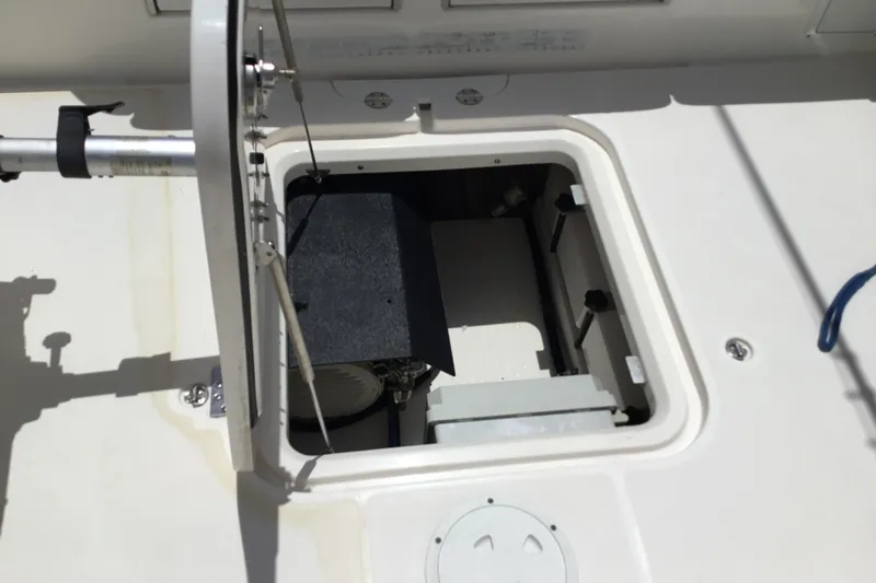 Slide: The Image of Open hatch on 2013 Everglades 320EX boat, showcasing interior compartment details. - 40