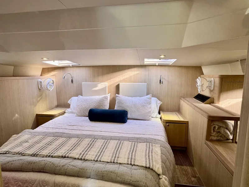 Slide: The Image of Luxurious bedroom interior of 2022 Aquila 44 yacht with cozy bedding and modern design. - 13