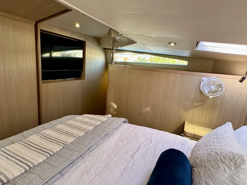 Slide: The Image of Luxurious cabin interior of 2022 Aquila 44 yacht with cozy bedding and modern amenities. - 14