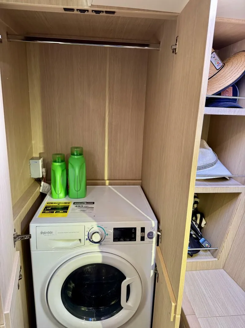 Slide: The Image of Laundry area with washing machine and detergent in Aquila 44, 2022 model. - 17