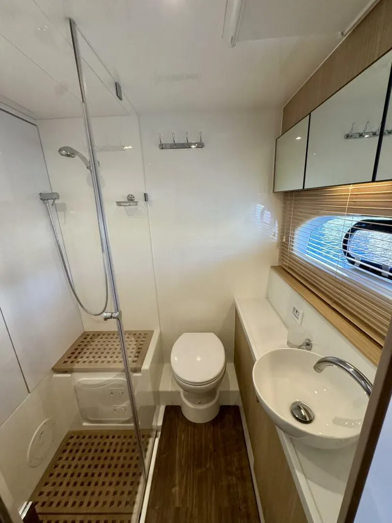 Slide: The Image of Modern bathroom in 2022 Aquila 44 yacht with shower, toilet, and sink. - 19