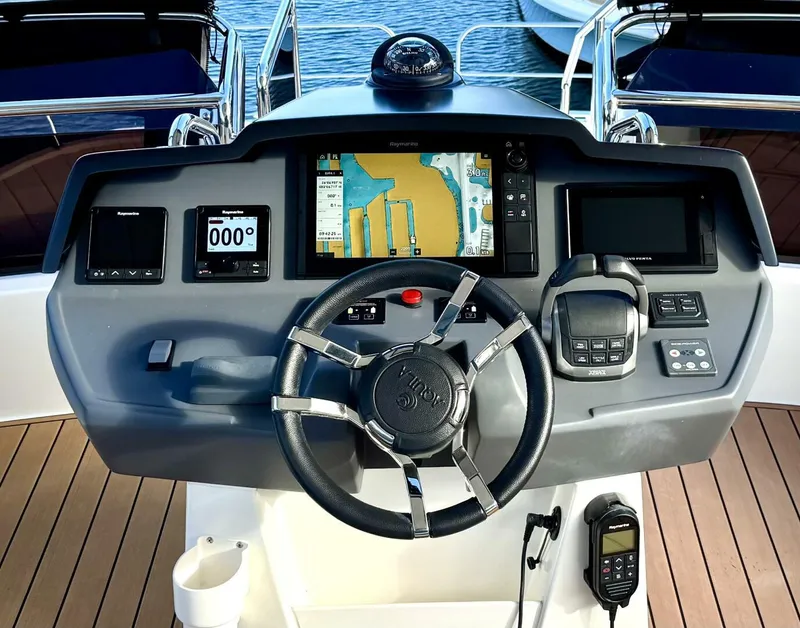 Slide: The Image of Helm of 2022 Aquila 44 yacht with navigation system and controls. - 22