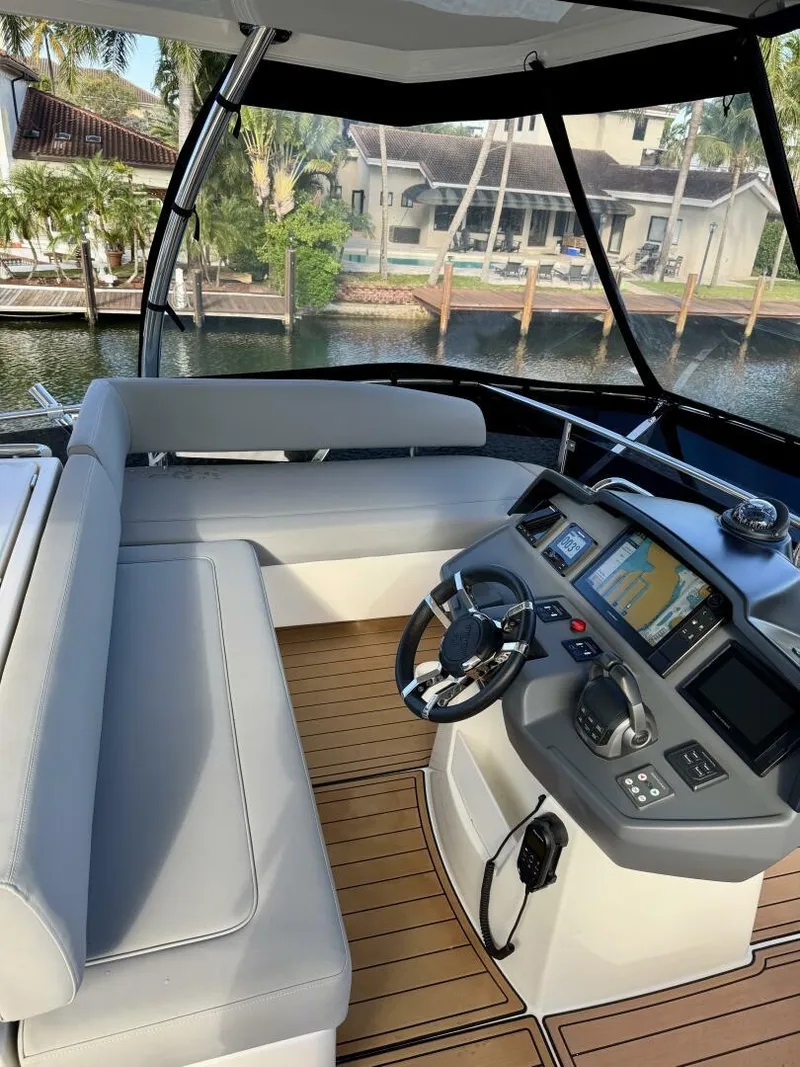 Slide: The Image of 2022 Aquila 44 yacht helm with modern navigation system and comfortable seating. - 24