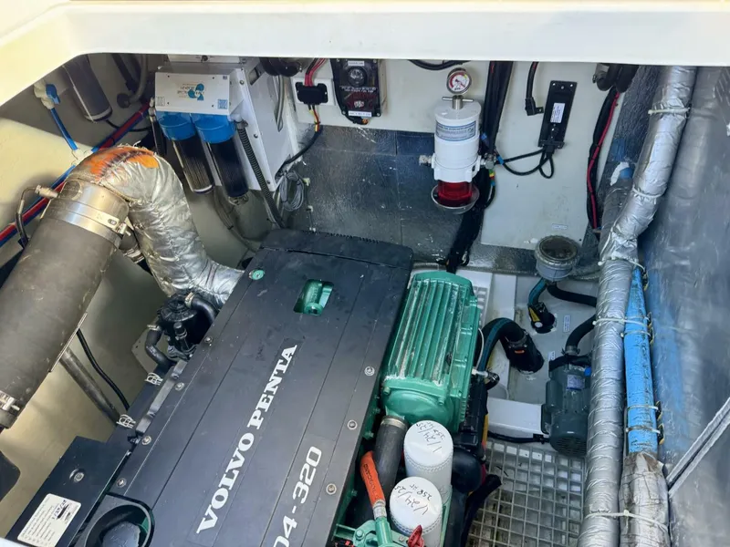 Slide: The Image of Engine room of 2022 Aquila 44 with Volvo Penta motor and various mechanical components. - 28