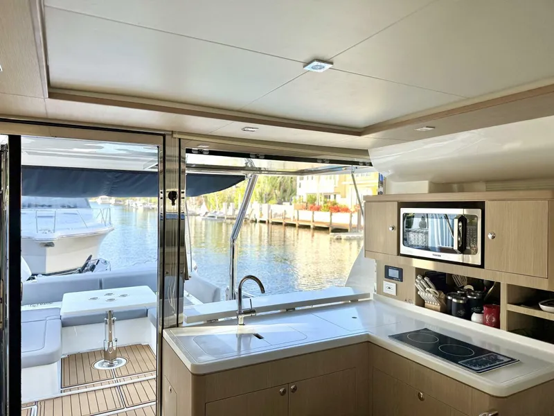 Slide: The Image of Modern kitchen interior of 2022 Aquila 44 yacht with waterfront view. - 6