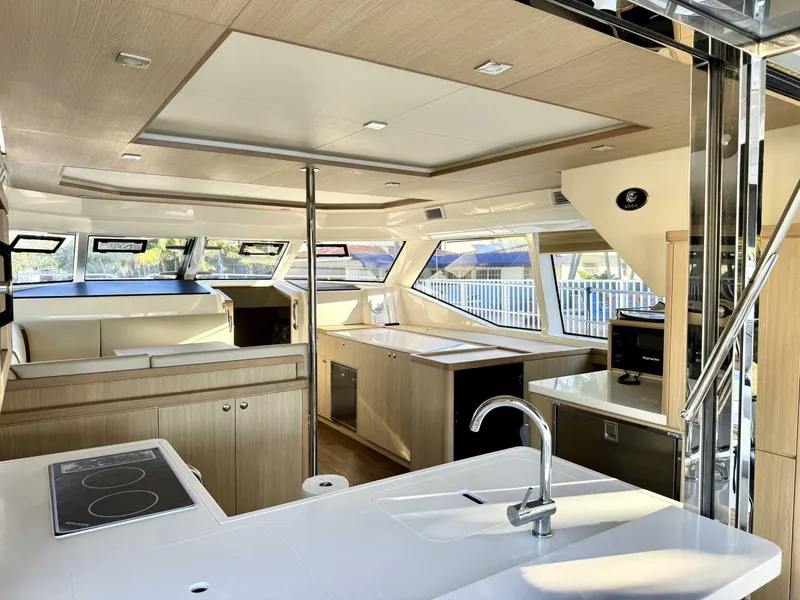Slide: The Image of Luxurious interior of 2022 Aquila 44 yacht with modern kitchen and seating area. - 8