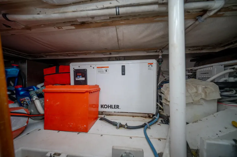 Slide: The Image of Engine room of 2003 Bertram 390 Convertible with Kohler generator and equipment. - 48