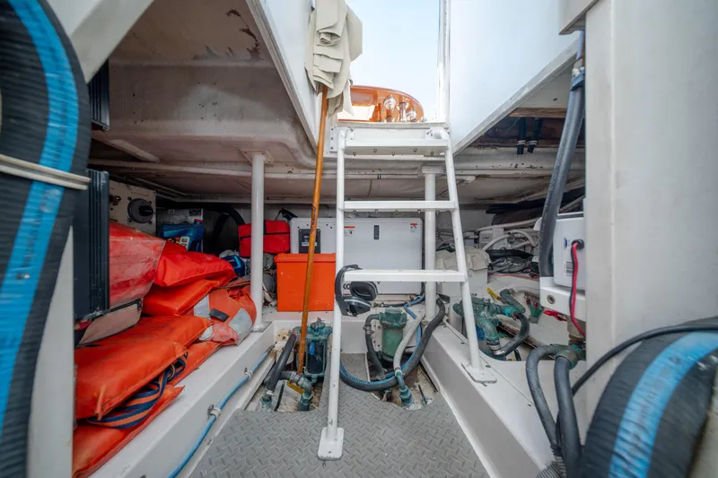 Slide: The Image of Engine room of 2003 Bertram 390 Convertible with equipment and safety gear. - 45