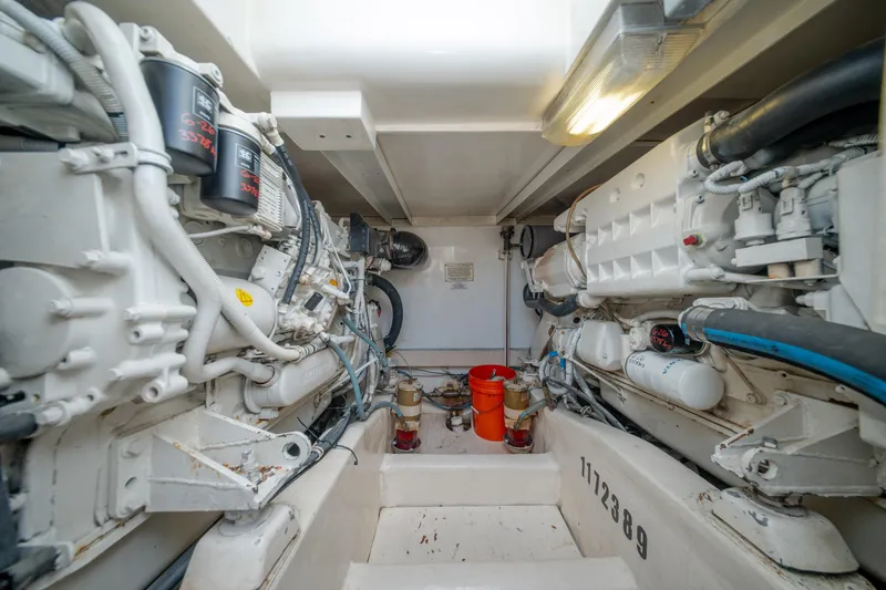 Slide: The Image of Engine room of a 2003 Bertram 390 Convertible yacht, showcasing mechanical components. - 42