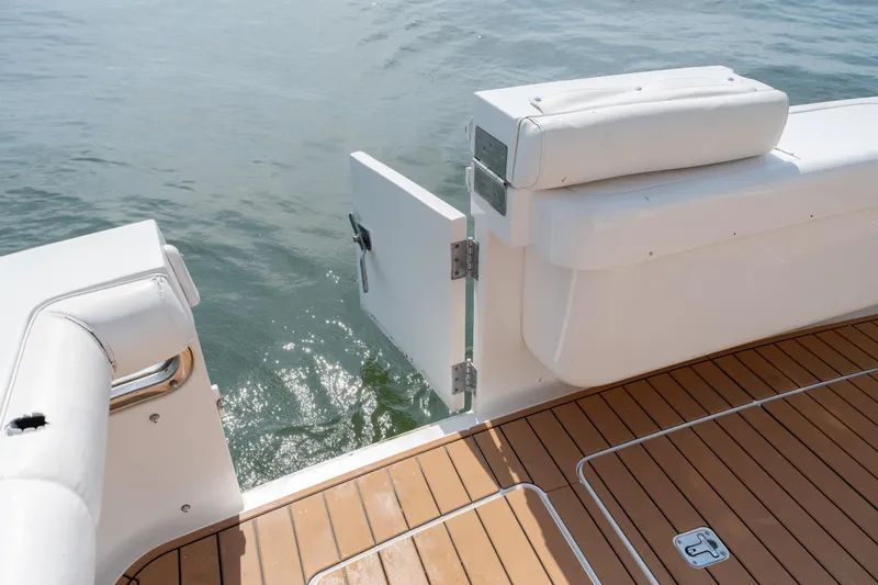 Slide: The Image of 2003 Bertram 390 Convertible boat with open transom door and teak deck. - 54