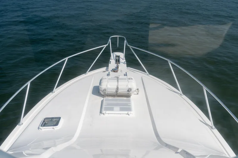 Slide: The Image of Bow view of 2003 Bertram 390 Convertible yacht on calm water. - 22