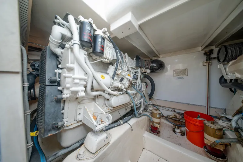 Slide: The Image of Engine room of a 2003 Bertram 390 Convertible boat, showcasing mechanical components. - 41