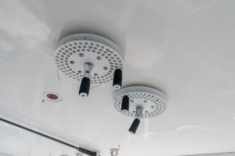 Slide: The Image of Ceiling-mounted controls on a 2003 Bertram 390 Convertible boat. - 20