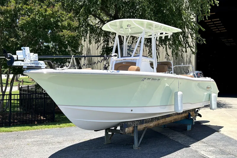 The Image of 2024 Sea Hunt Ultra 234 boat on display, featuring sleek design and modern equipment. - 0