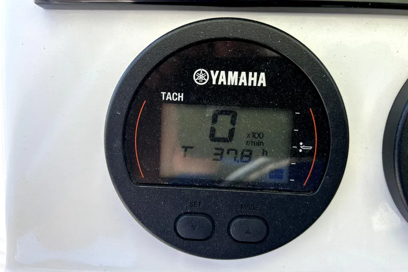 Slide: The Image of Yamaha tachometer on 2024 Sea Hunt Ultra 234 boat, displaying 37.8 hours. - 10