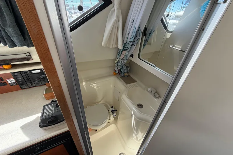 Slide: The Image of Interior of 2005 Bayliner 288 Classic boat bathroom with toilet and sink. - 5