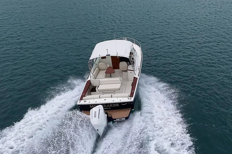 Slide: The Image of 2020 Hunt Yachts Harrier 26 cruising on open water, rear view. - 10