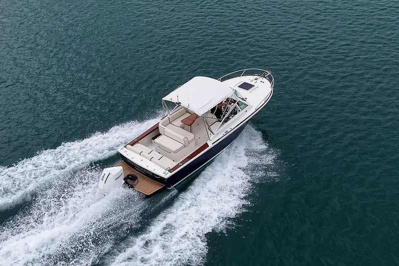 Slide: The Image of 2020 Hunt Yachts Harrier 26 cruising on open water, showcasing sleek design and powerful performance. - 11