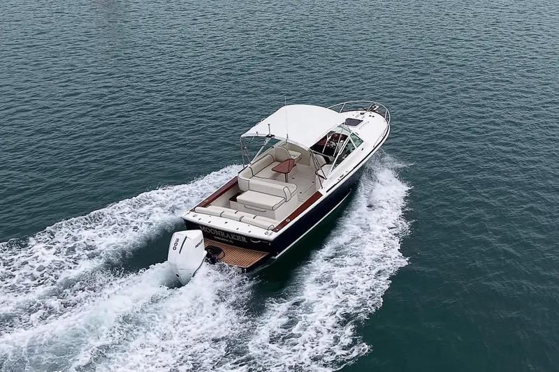 Slide: The Image of 2020 Hunt Yachts Harrier 26 cruising on open water, showcasing sleek design and powerful engine. - 14
