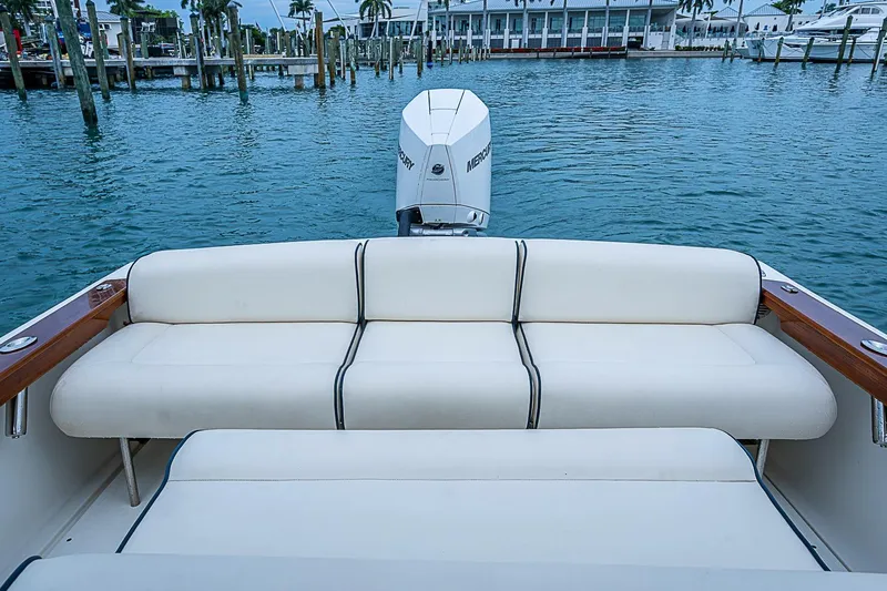 Slide: The Image of 2020 Hunt Yachts Harrier 26 with white seating and Mercury outboard engine. - 17