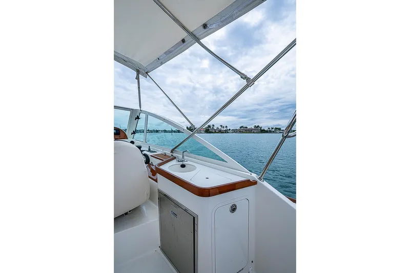 Slide: The Image of 2020 Hunt Yachts Harrier 26 interior with ocean view and sleek design. - 20