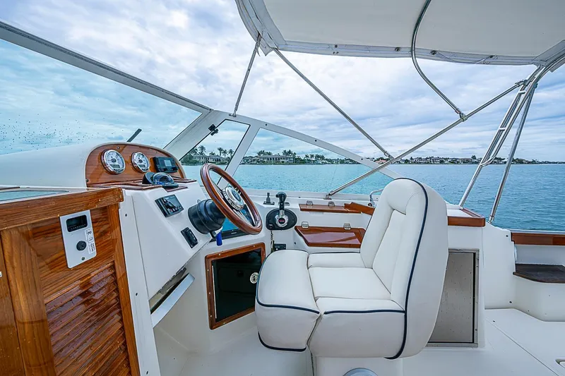 Slide: The Image of 2020 Hunt Yachts Harrier 26 helm with luxurious seating and scenic ocean view. - 22
