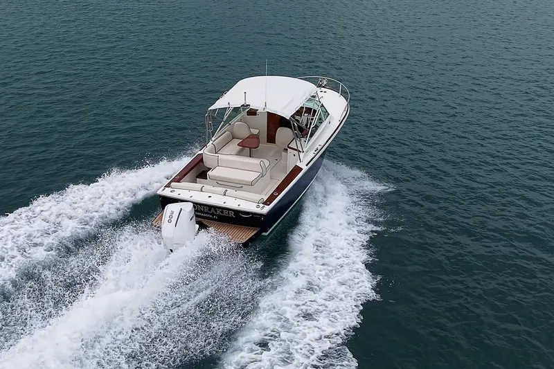 Slide: The Image of 2020 Hunt Yachts Harrier 26 cruising on open water, showcasing sleek design and powerful performance. - 9