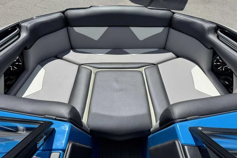 Slide: The Image of 2022 Moomba Kaiyen boat interior with gray and black seating, showcasing modern design. - 17
