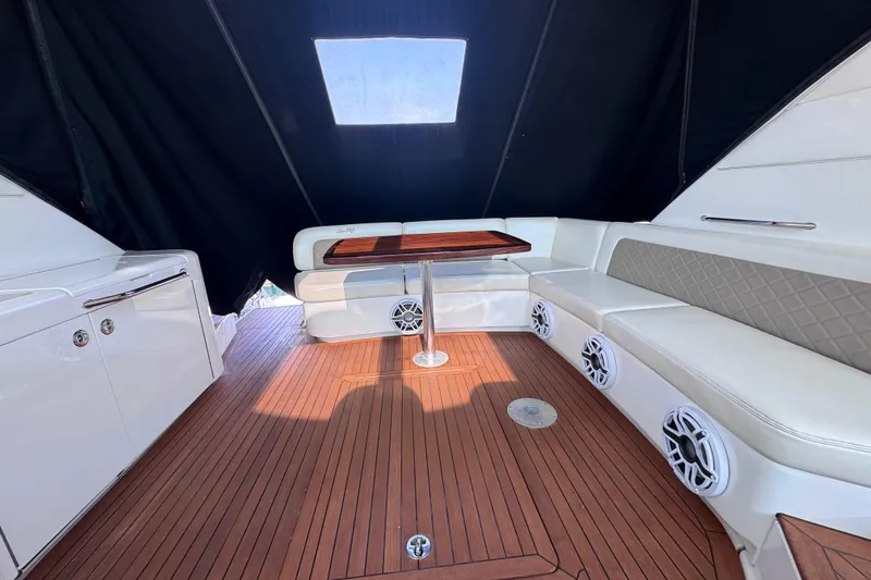 Slide: The Image of Luxurious 2011 Sea Ray 540 Sundancer yacht interior with elegant seating and wood flooring. - 12
