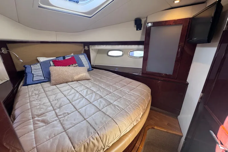 Slide: The Image of Luxurious cabin interior of 2011 Sea Ray 540 Sundancer yacht with cozy bed and modern decor. - 49