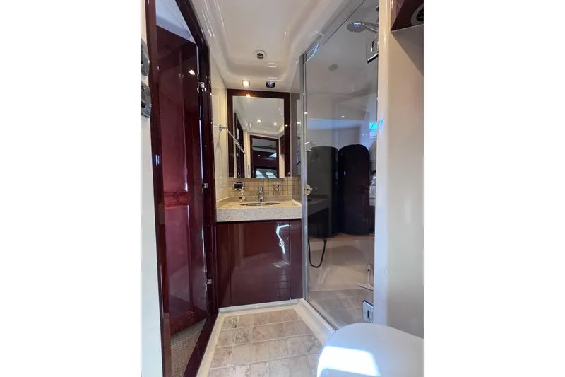 Slide: The Image of Luxurious bathroom in 2011 Sea Ray 540 Sundancer yacht with modern fixtures and glass shower. - 55