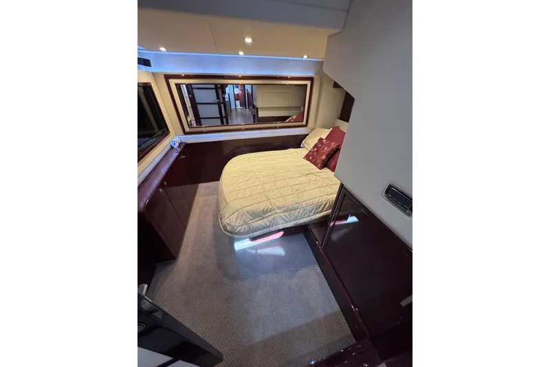 Slide: The Image of Luxurious bedroom interior of 2011 Sea Ray 540 Sundancer yacht with elegant bedding. - 61