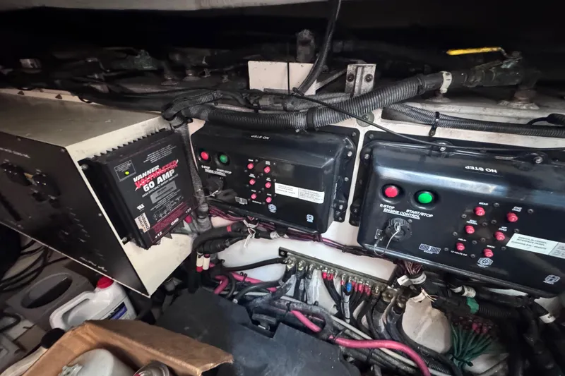 Slide: The Image of Engine room of 2011 Sea Ray 540 Sundancer with electrical panels and wiring. - 75